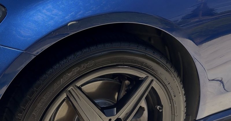 The same wheel and wing after cleaning — spokes clean and the paint reflecting sharply