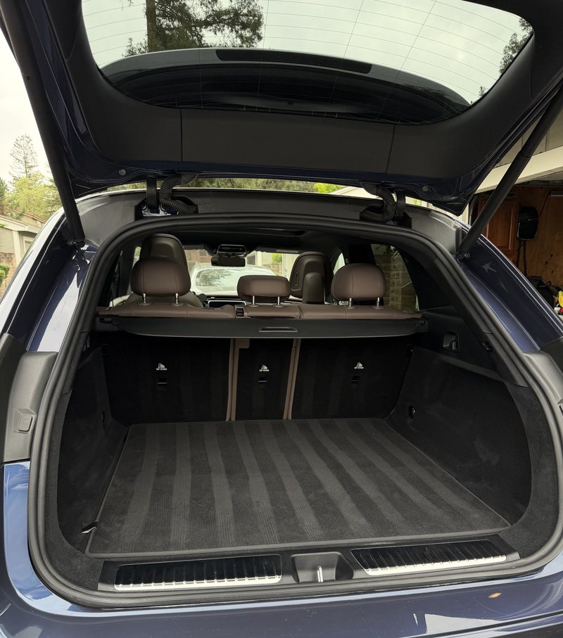 Estate car cargo area after cleaning — carpet vacuumed and evenly brushed