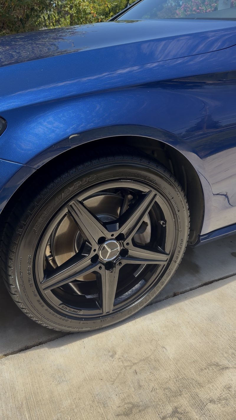 The same wheel and wing after cleaning — spokes clean and the blue paint reflecting sharply
